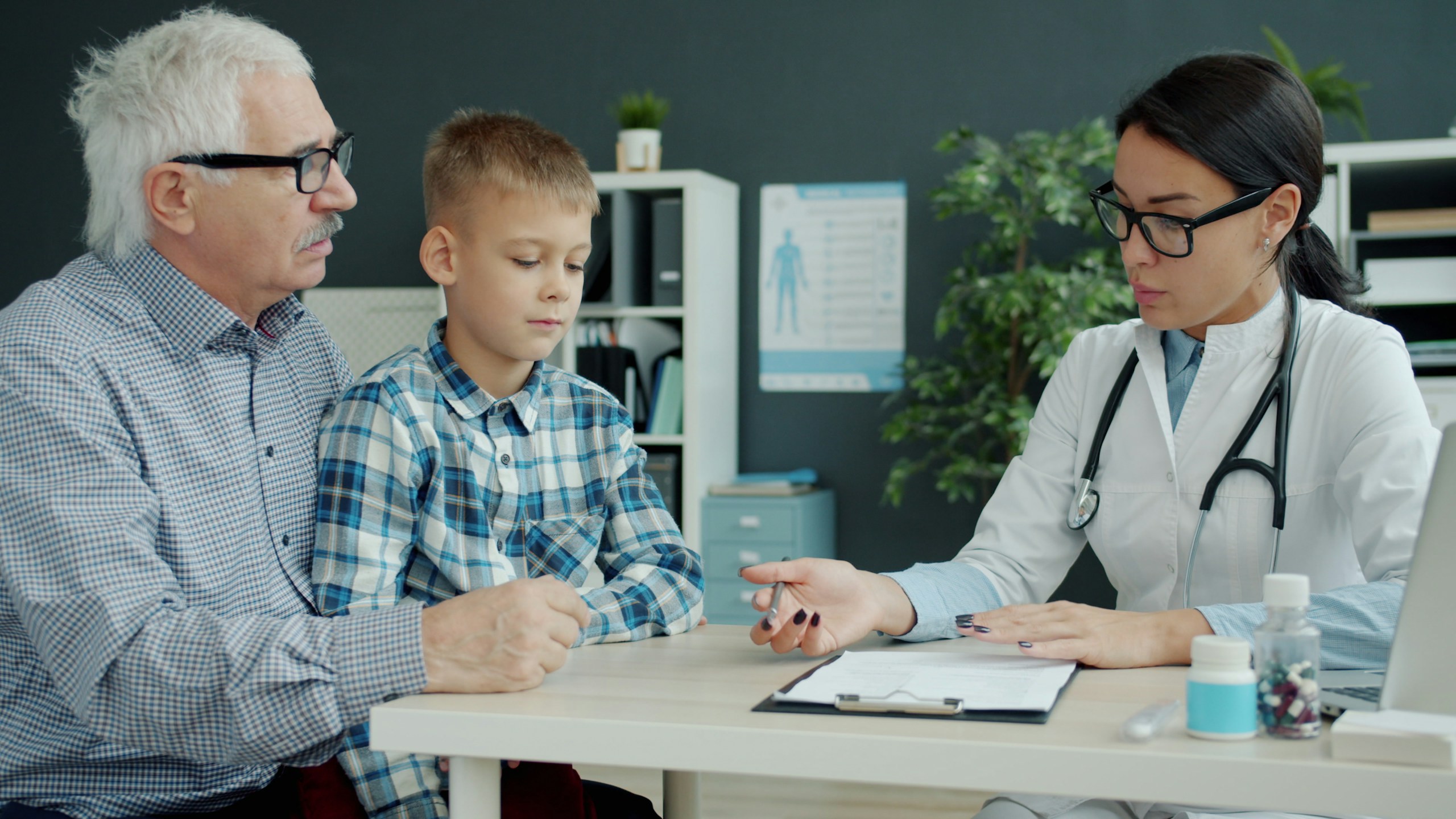 Illustrative child consultation with family members in a medical clinic